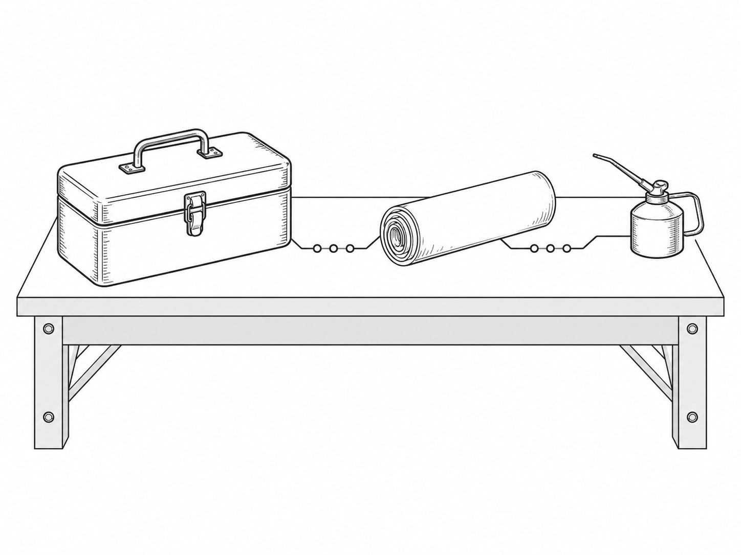 A closed metal toolbox beside a rolled blank blueprint on a workbench.