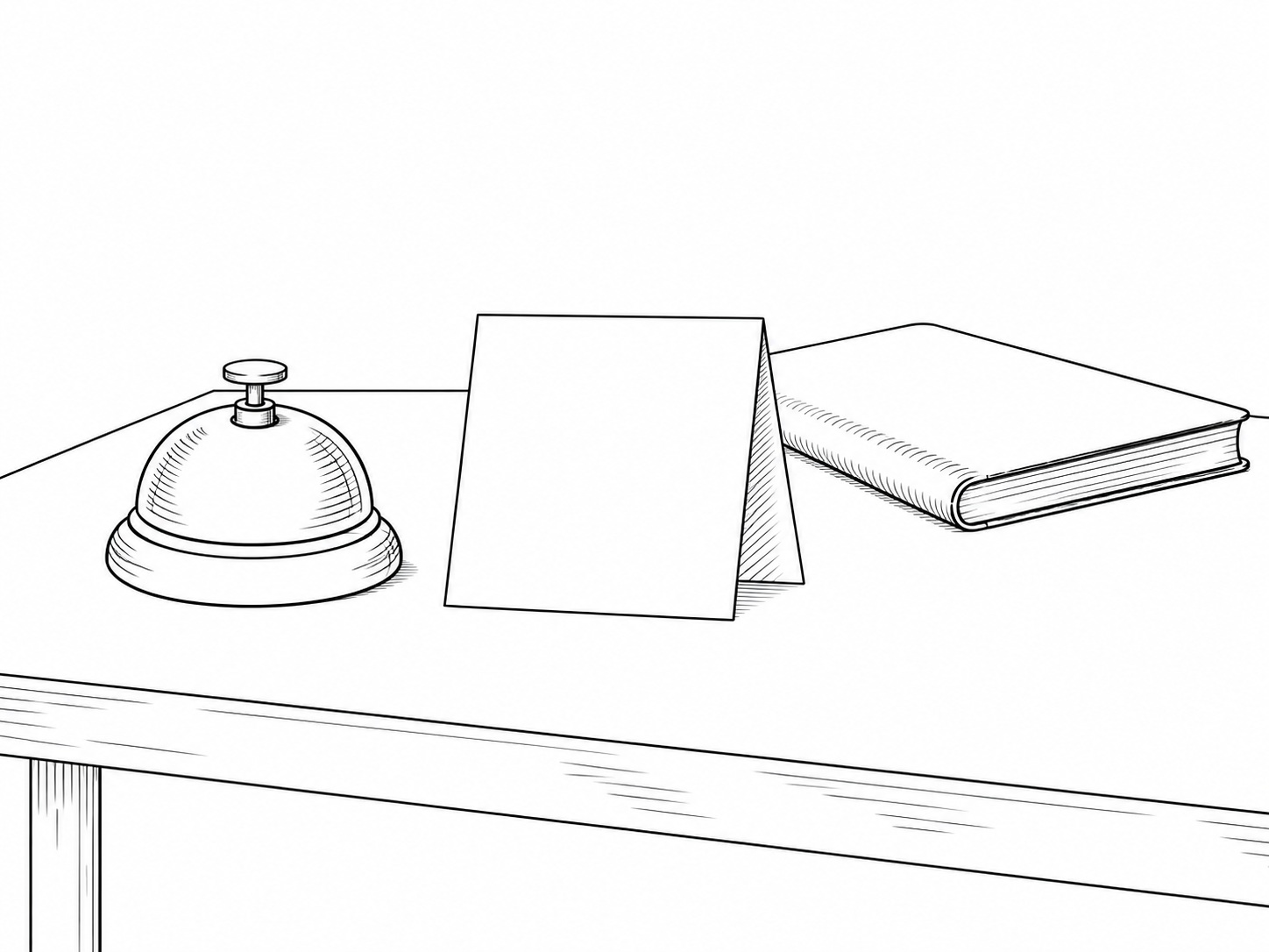A small brass bell and a folded blank card standing upright on a clean desk beside a closed notebook.