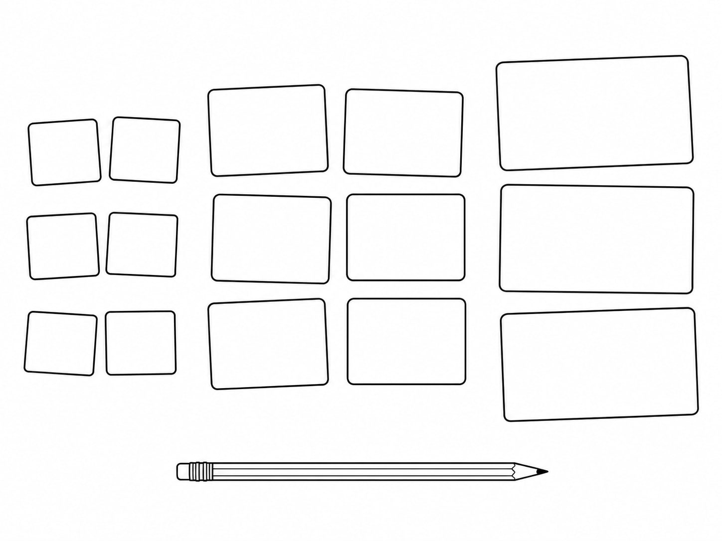 A row of blank index cards laid out in three loose groups on a table, with a pencil resting across them.
