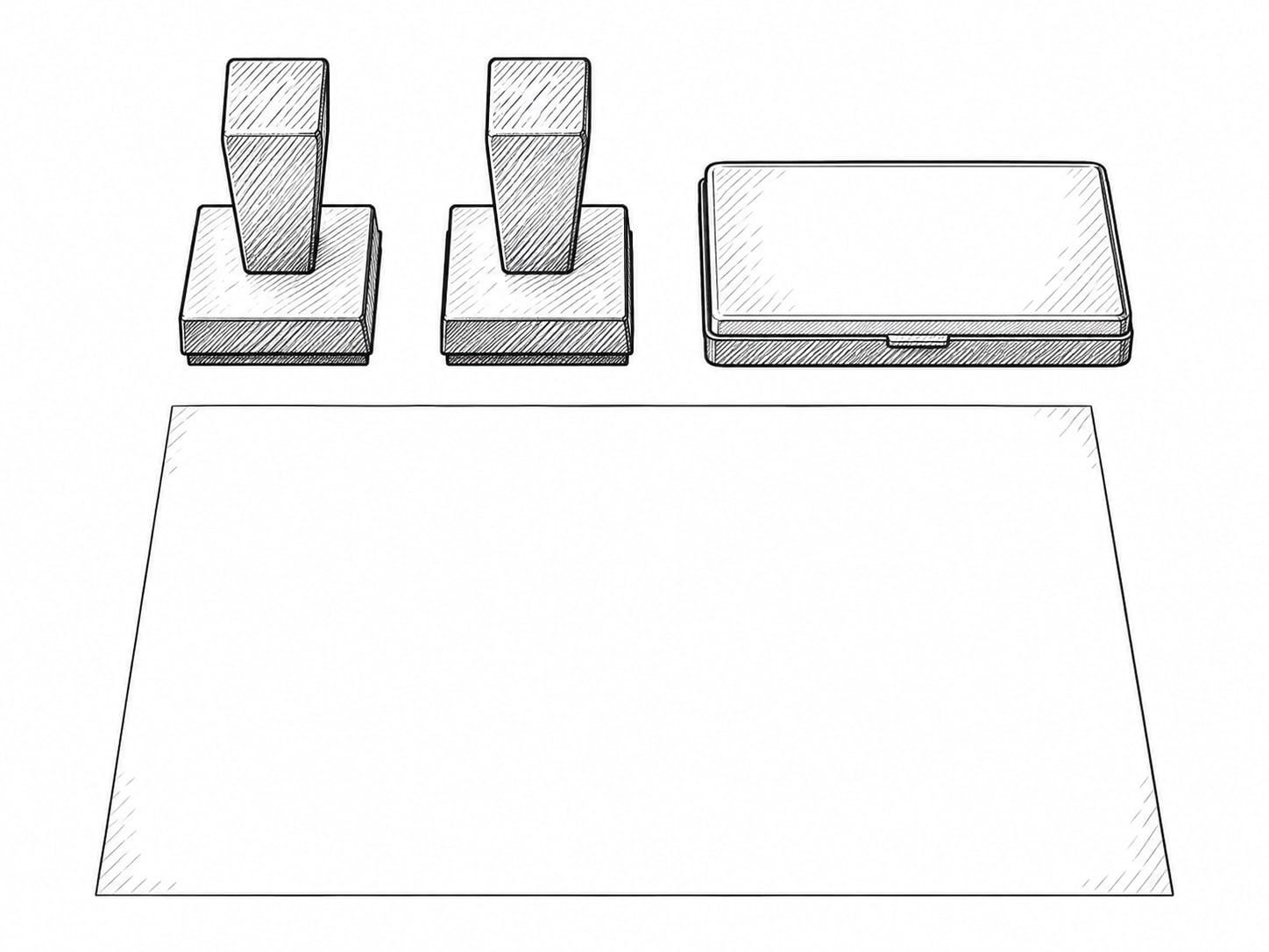Two identical rubber stamps side by side on a sheet of blank paper next to a closed ink pad.