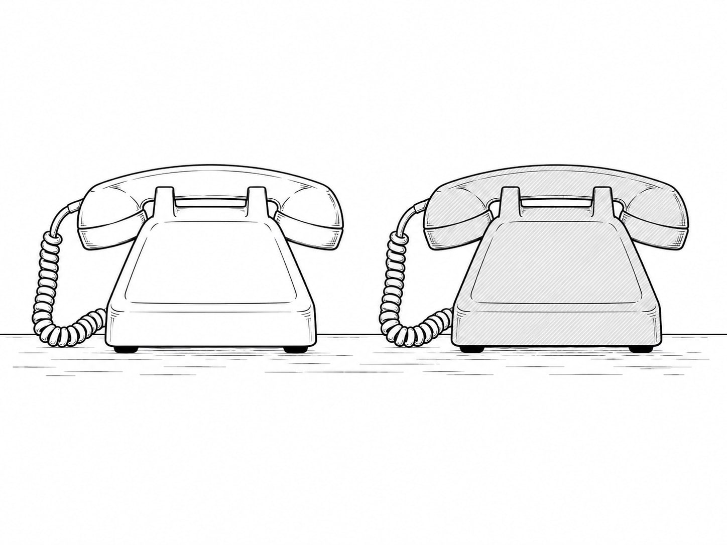 Two corded desk telephones standing side by side on a counter, one cream and one gray.