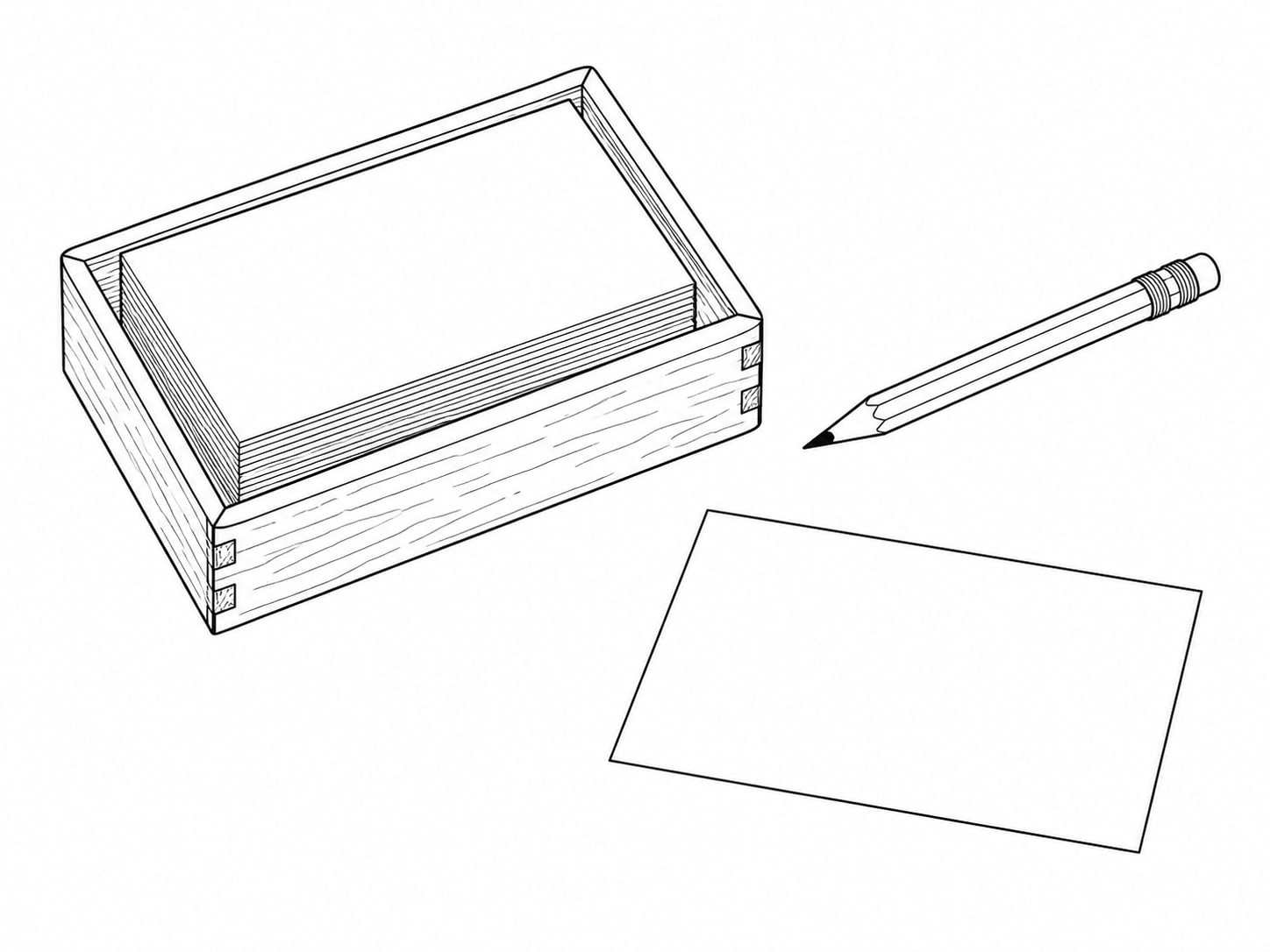 A small wooden tray holding a stack of blank index cards beside a pencil, with one card set apart from the stack.