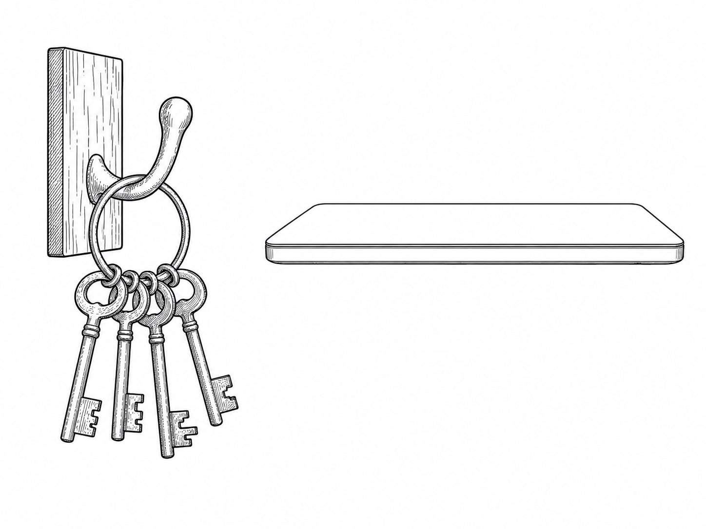 A small ring of unlabeled brass keys hanging from a wooden wall hook beside a closed laptop.