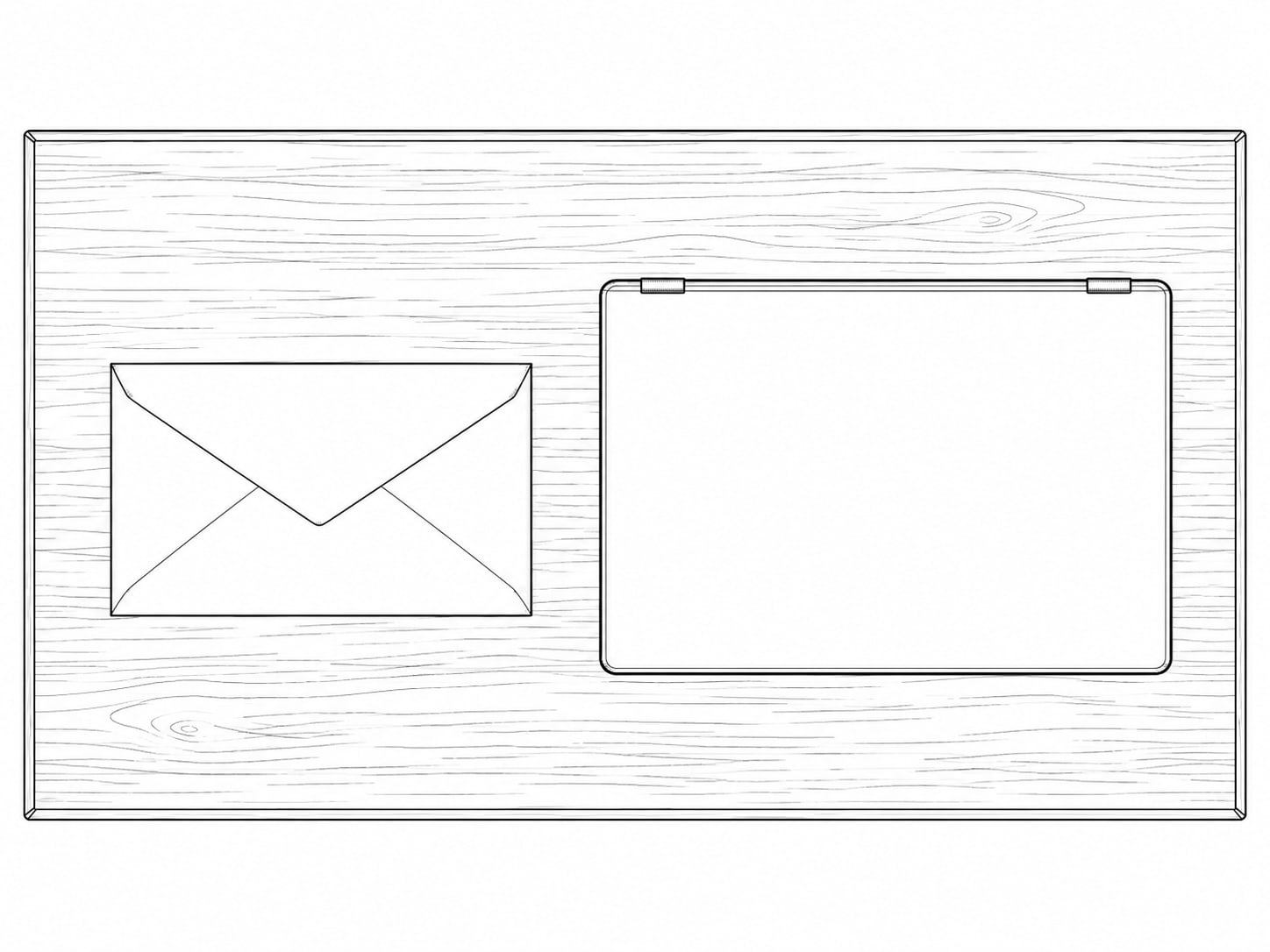 A sealed paper envelope and a closed laptop side by side on a clean wooden desk.