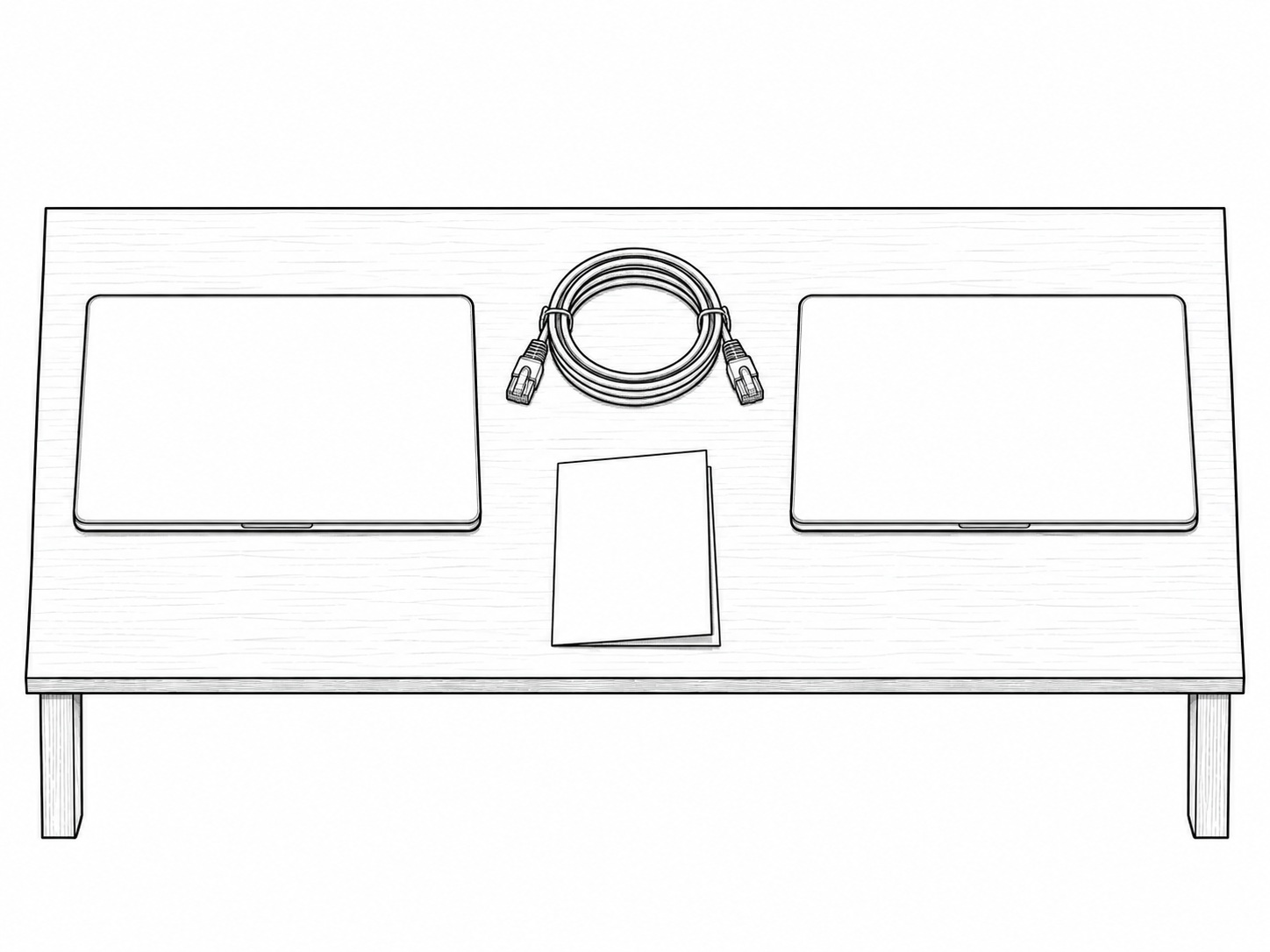 Two closed laptops side by side on a wooden table, with a coiled network cable and a folded sheet of blank paper between them.